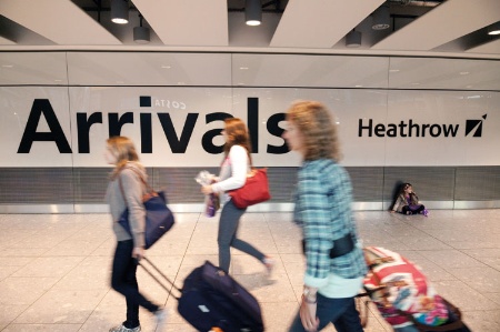 Female passengers arriving at airport arrivals