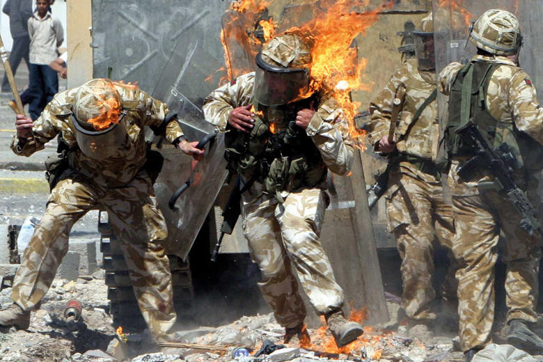 British Army troops covered in flames from petrol bomb, Basra, Iraq British Army troops covered in flames from petrol bomb, Basra, Iraq