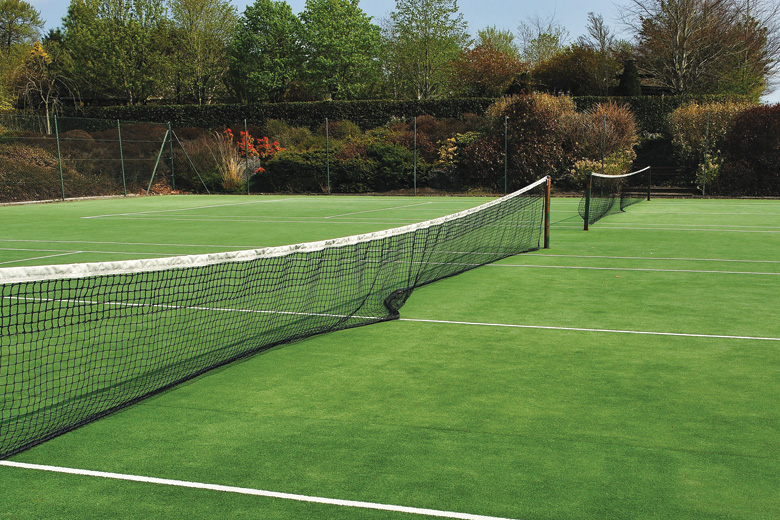 Deserted grass tennis courts Deserted grass tennis courts
