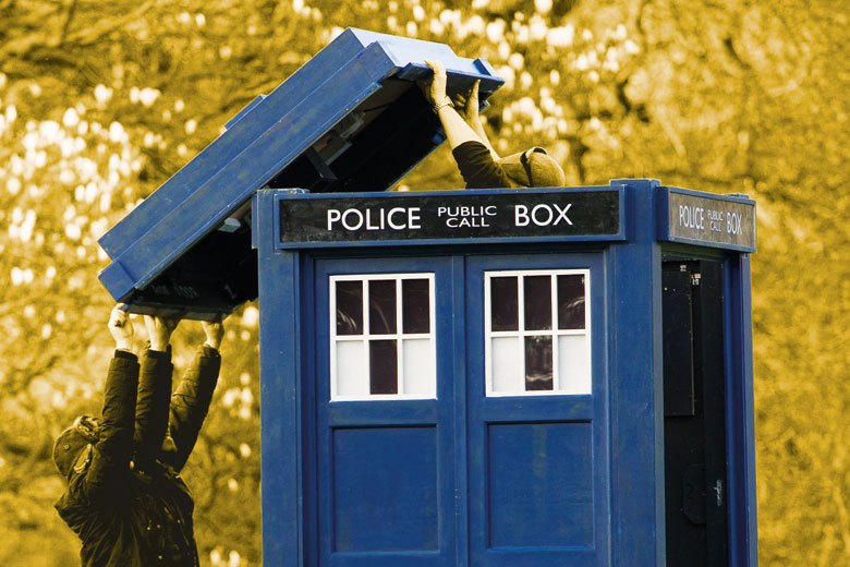 People lifting lid off Doctor Who's tardis People lifting lid off Doctor Who's tardis
