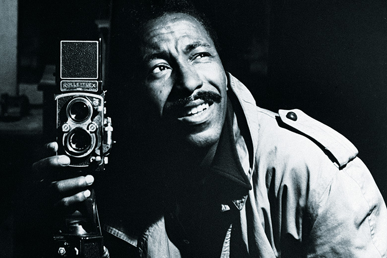 Photographer Gordon Parks posing with camera Photographer Gordon Parks posing with camera