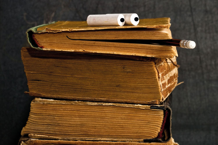 Pile of books with smiling face Pile of books with smiling face