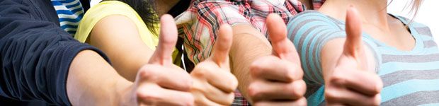 National Student Survey 2014 results, students holding thumbs up