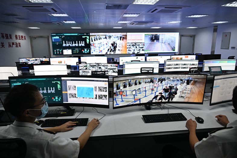 Staff members monitor screens in a control room at Shanghai Pudong International Airport in Shanghai, China. To illustrate that Western researchers fear they are being monitored when travelling to China. Staff members monitor screens in a control room at Shanghai Pudong International Airport in Shanghai, China. To illustrate that Western researchers fear they are being monitored when travelling to China.