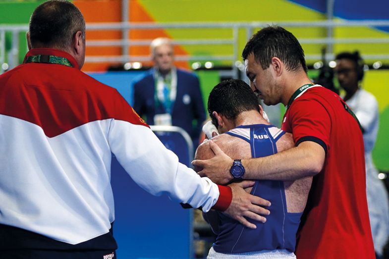 coach comforts athlete Coach comforts athlete