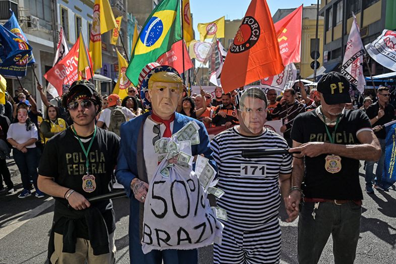 Protesters wearing masks depicting US president Donald Trump and former Brazilian president Jair Bolsonaro take part in a demonstration in downtown São Paulo, Brazil on 18 July 2025. Protesters wearing masks depicting US president Donald Trump and former Brazilian president Jair Bolsonaro take part in a demonstration in downtown São Paulo, Brazil on 18 July 2025.