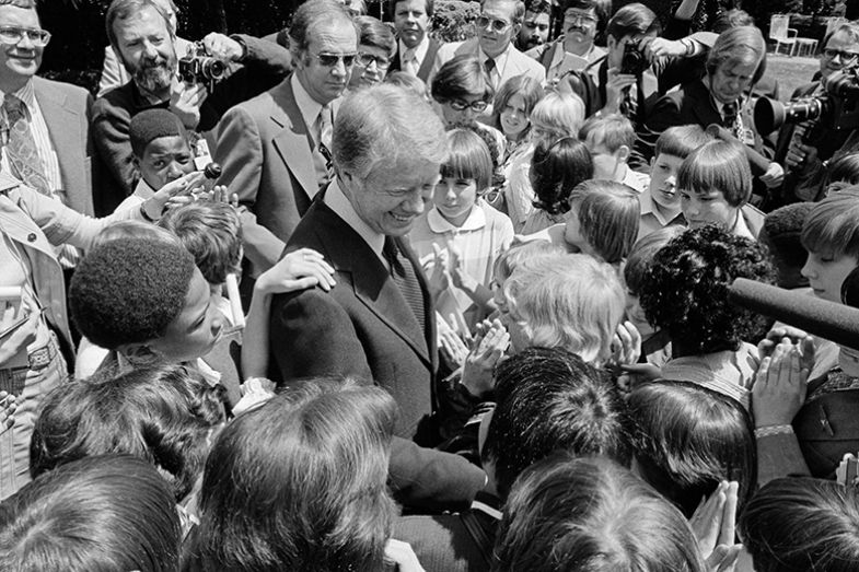 President Jimmy Carter surrounded by schoolchildren in North Carolina, 29 April 1977.