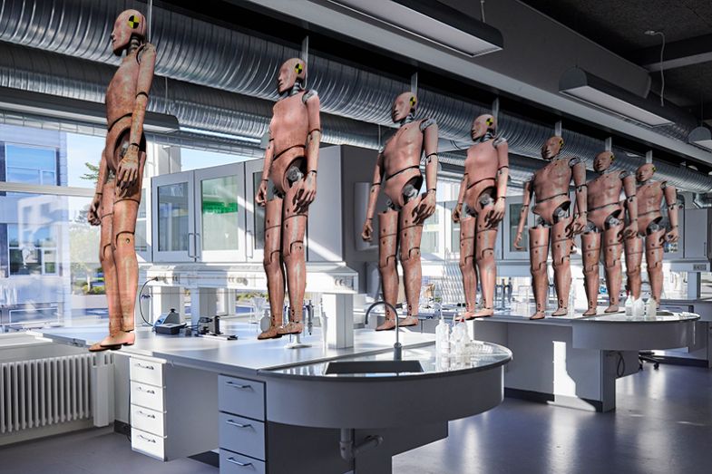 Crash test dummies being conveyed in to a laboratory. To illustrate a system where more academic doctors are trained than can be absorbed and a high level of churn is normalised.