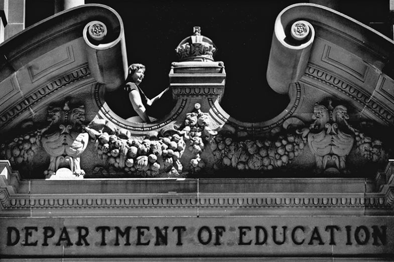 Education Department to hold an open day at the Department of Education building, Sydney, Australia. A long-serving employee sits at the main entrance to the building, 29 November 1989.
