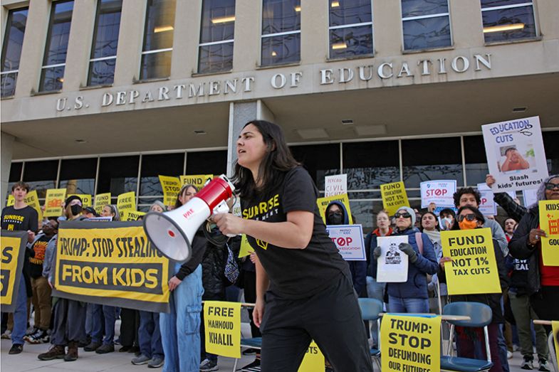 Demonstrators gather outside the offices of the US Department of Education in Washington, DC on 13 March 2025 to protest against mass layoffs and budget cuts at the agency, initiated by the Trump administration and Doge.
