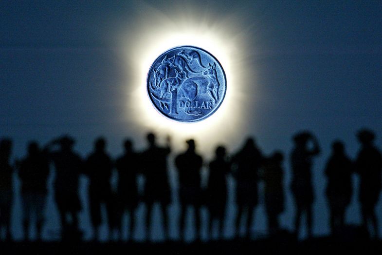 Tourists watch the sun being blocked by the moon during a solar eclipse in the Australian outback town of Lyndhurst, with a dollar coin instead of the moon. To illustrate how Australia's funding system could diminish blue-sky research. Tourists watch the sun being blocked by the moon during a solar eclipse in the Australian outback town of Lyndhurst, with a dollar coin instead of the moon. To illustrate how Australia's funding system could diminish blue-sky research.