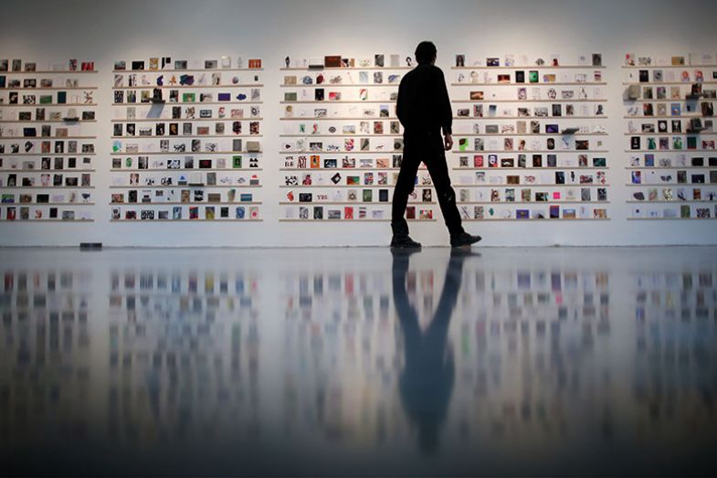 Man looking at exhibition Man looking at exhibition