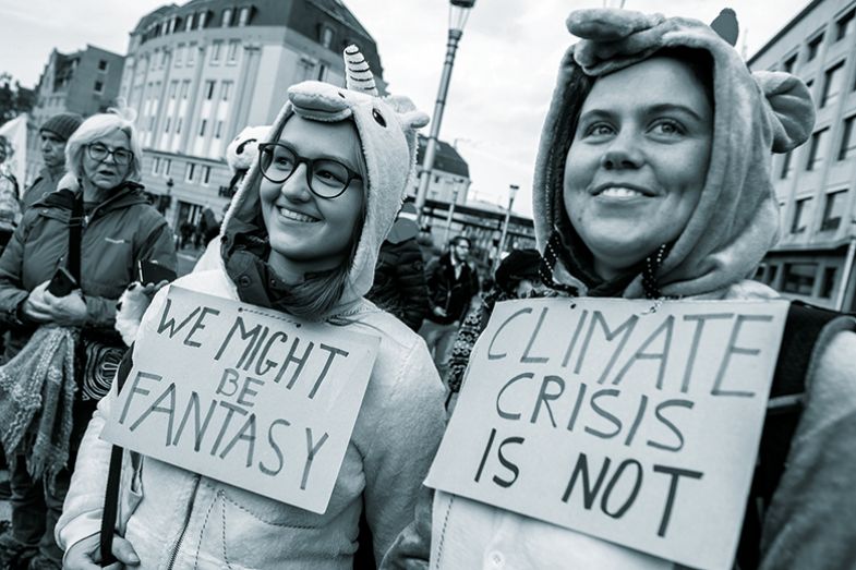 climate protesters wearing unicorn onesies climate protesters wearing unicorn onesies