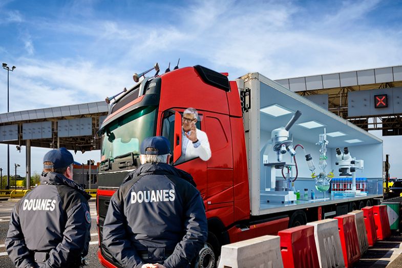 Scientist driving a truck filled with his laboratory across a border. To illustrate free movement for research in the European Research Area. Scientist driving a truck filled with his laboratory across a border. To illustrate free movement for research in the European Research Area.