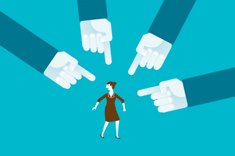 Woman with large hands pointing at her. To illustrate that academics are inclined to perceive bullying much more frequently than they once did.