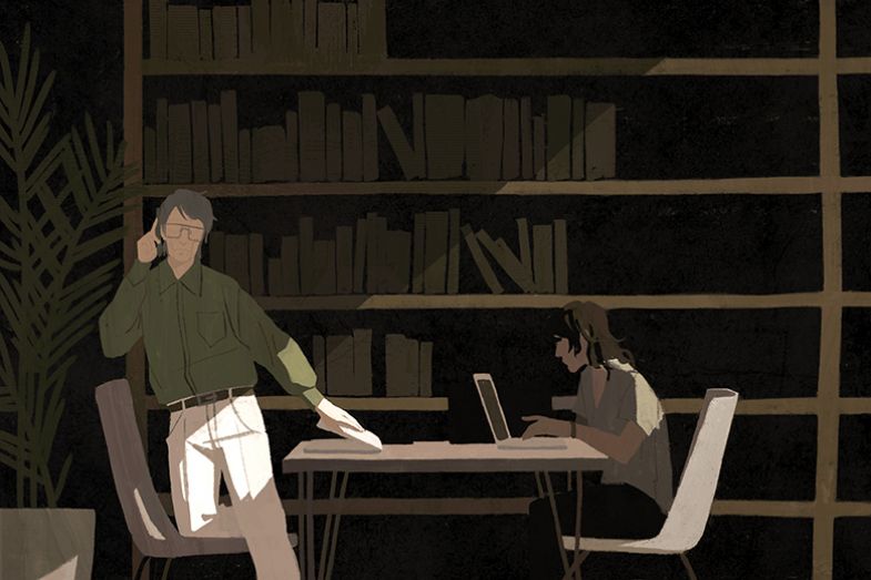 two people working in the library two people working in the library