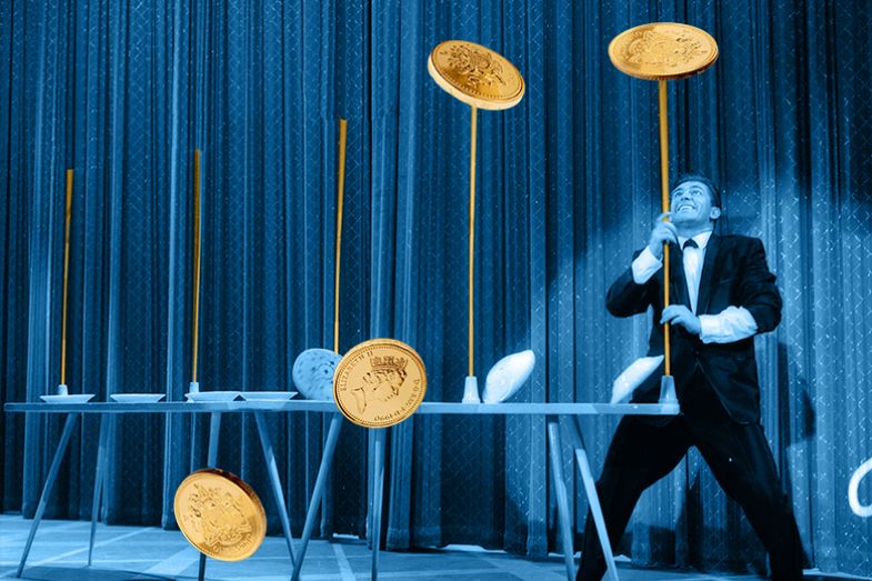 A man spinning gold coins on sticks. To illustrate that university finances could be put in a precarious position with new proposals for the Teaching Excellence Framework. A man spinning gold coins on sticks. To illustrate that university finances could be put in a precarious position with new proposals for the Teaching Excellence Framework.