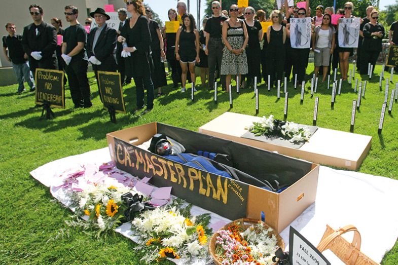 Protesters around a coffin with masterplan written on the side Protesters around a coffin with masterplan written on the side