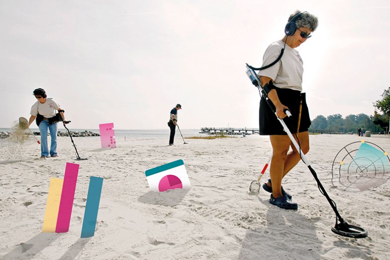 Metal detectors on beach