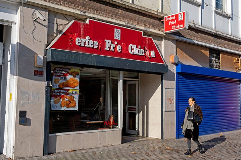 Incomplete sign for a Perfect Fried Chicken fast food takeaway restaurant in Stratford, London. To illustrate reputational damage to UK HE that can be caused by “rogue trader” franchises.