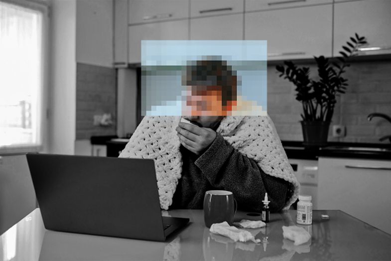 Man working from home while ill, with his face pixelated. To illustrate that illnesses can be hidden from managers by home-working policies.