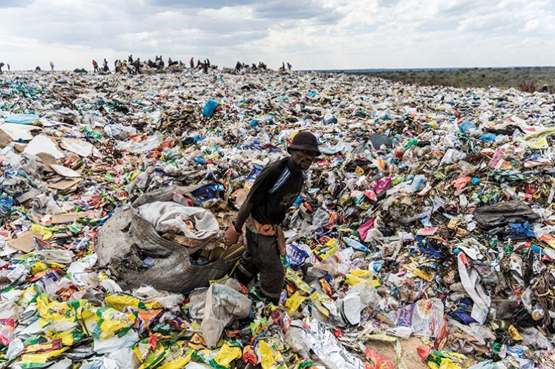 A recycler drags a bag of paper past a heap of non-recyclable material at a sanitary landfill site in Bulawayo, Zimbabwe A recycler drags a bag of paper past a heap of non-recyclable material at a sanitary landfill site in Bulawayo, Zimbabwe