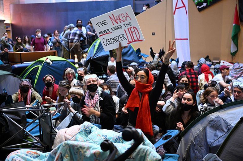 Protesters gather inside of building at Melbourne University in Melbourne, Wednesday, 15 May 2024. An encampment at Melbourne University has been ordered to be dismantled. 