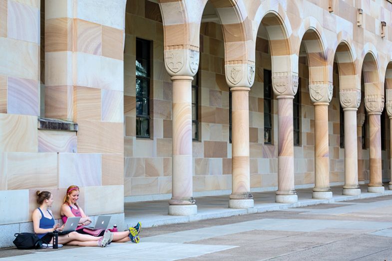Students using laptops on University of Queensland campus Students using laptops on University of Queensland campus