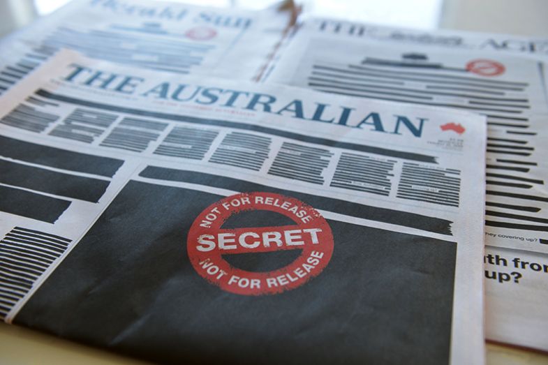 Front page of The Australian newspaper is seen on 21 October 2019 in Melbourne, Australia. The front page of every newspaper across Australia was blacked out as part of a protest against media restrictions. To illustrate non-disclosure agreements.