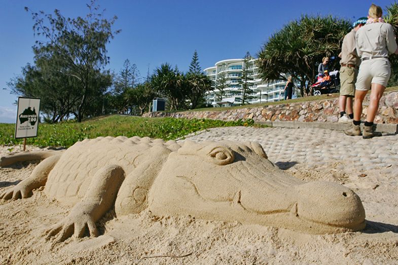 Saltwater crocodile sand sculpture during the Australia Zoo on the beach launch in Mooloolaba, Australia. To illustrate a fake danger – whether Australian universities have been crying wolf over their finances.