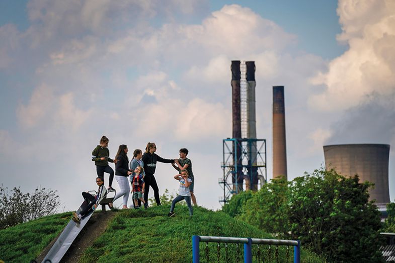 Children play in a park near British Steel’s Scunthorpe works which was forced into liquidation in 2019 Children play in a park near British Steel’s Scunthorpe works which was forced into liquidation in 2019