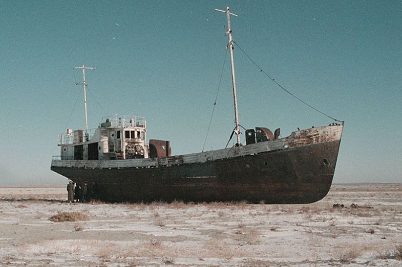 An abandoned fishing vessel in the Aral Sea, 1999. The Aral Sea is an inland sea, east of the Caspian Sea, mainly in Kazakhstan. The diversion of water from rivers supplying the sea for cotton irrigation projects has upset the ecological balance. An abandoned fishing vessel in the Aral Sea, 1999. The Aral Sea is an inland sea, east of the Caspian Sea, mainly in Kazakhstan. The diversion of water from rivers supplying the sea for cotton irrigation projects has upset the ecological balance.