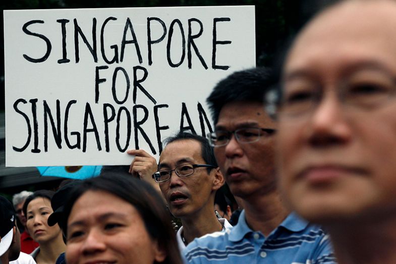Placard saying ‘Singapore for Singaporeans’ during a protest against an immigration plan in Singapore in 2013. To illustrate that the local population is not keen on subsidising international students. Placard saying ‘Singapore for Singaporeans’ during a protest against an immigration plan in Singapore in 2013. To illustrate that the local population is not keen on subsidising international students.