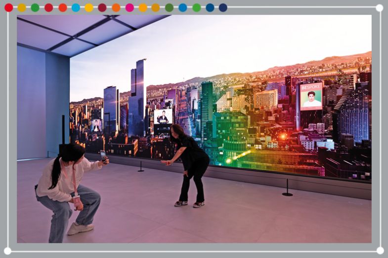 People in front of an LED wall during the opening of the new Samsung Electronics Co. store in the Gangnam District of Seoul, South Korea. To illustrate South Korean universities performing well for SDG9 (industry, innovation and infrastructure)