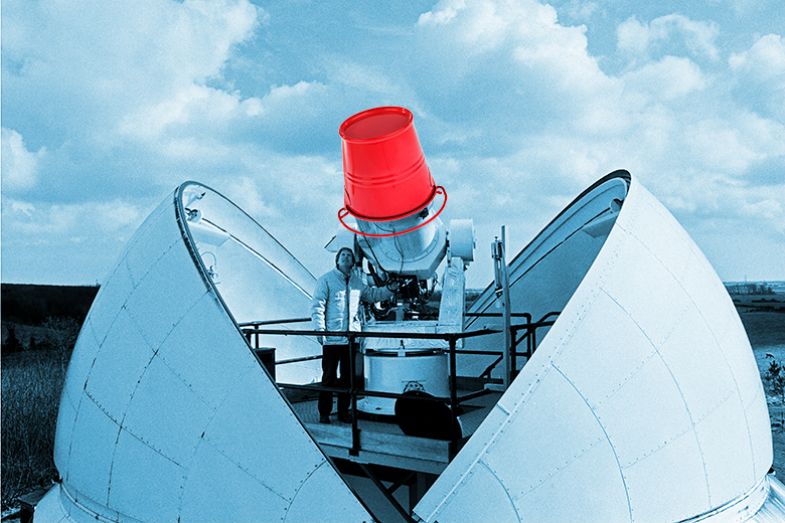 An astronomer with the telescope covered by a bucket, illustrating that the bucket approach to UKRI funding could mean a decrease in grants available to physics and astronomy researchers.
