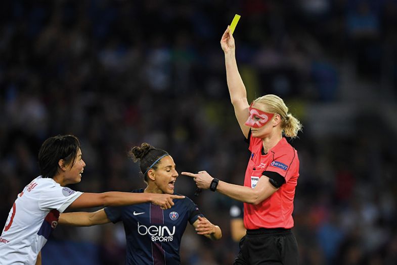 Referee giving yellow card