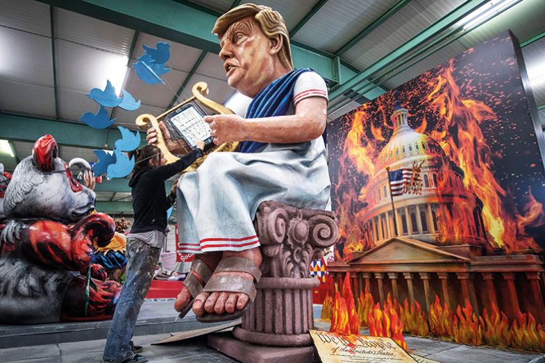 US President Donald Trump as the harp-playing Emperor Nero in front of a burning White House US President Donald Trump as the harp-playing Emperor Nero in front of a burning White House