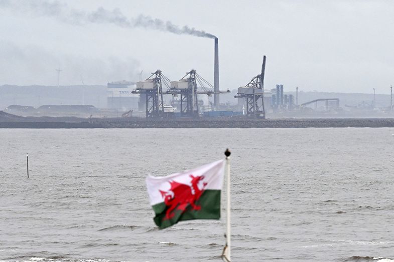 A Welsh flag flaps in the wind on Bay Campus Beach near to Tata Steel Port Talbot. To illustrate that Wales needs to consider local needs, and the working-class heritage of Welsh higher education. A Welsh flag flaps in the wind on Bay Campus Beach near to Tata Steel Port Talbot. To illustrate that Wales needs to consider local needs, and the working-class heritage of Welsh higher education.