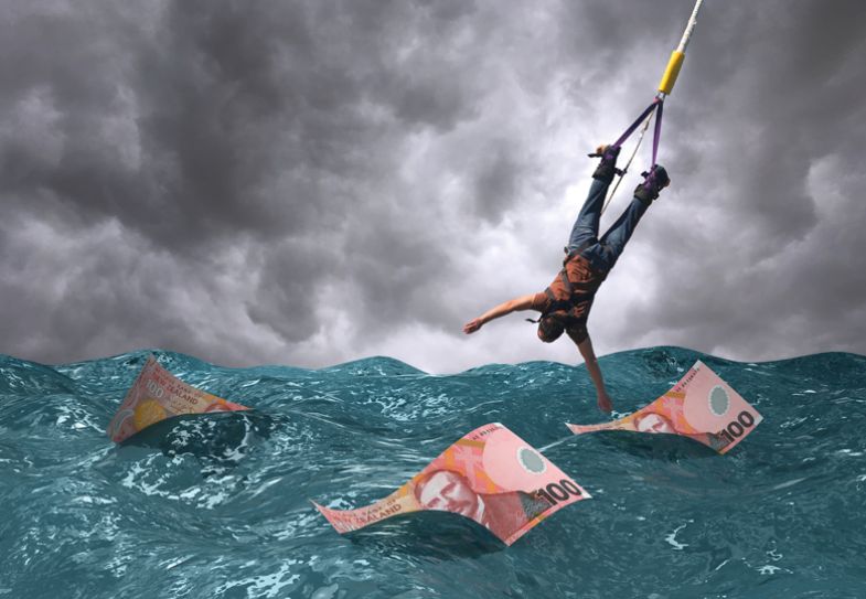 Montage of New Zealand dollar money in the sea with a man swinging on a bungee Montage of New Zealand dollar money in the sea with a man swinging on a bungee