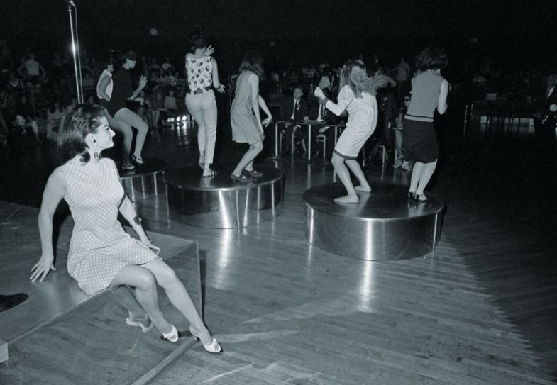 Michell Neville, 24, of Vichy, France, sits on the bandstand watching girls dance at the Cheetah nightclub Michell Neville, 24, of Vichy, France, sits on the bandstand watching to illustrate Even wallflowers can flourish girls dance at the Cheetah nightclub