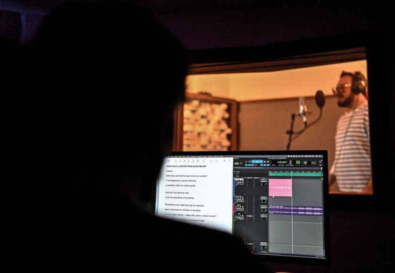 Recording session at a studio by a voiceover artist for an audiobook Recording session at a studio by a voiceover artist for an audiobook