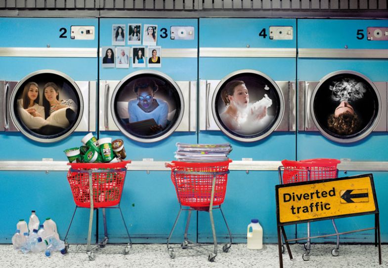 Montage of a launderette with faces in each machine Montage of a launderette with faces in each machine