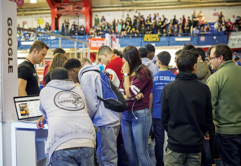  Personnel from Google interact with visitors at a Career Expo to explain about Google recruitment