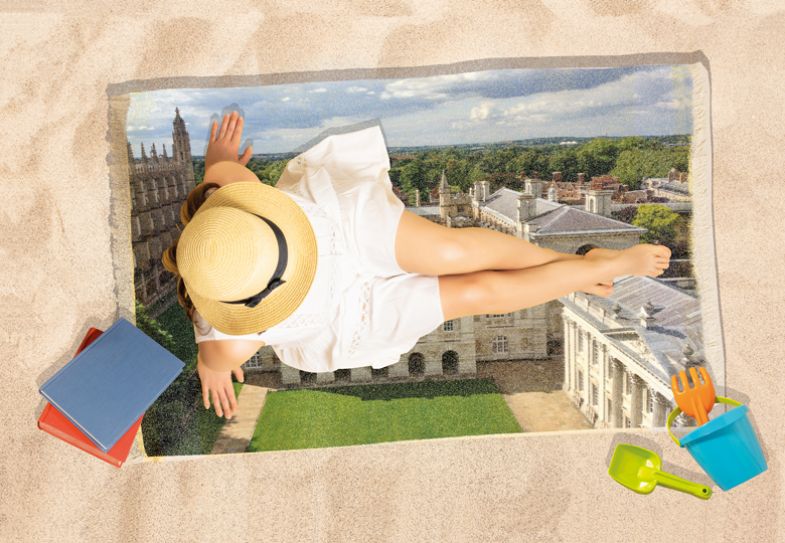 Montage of lady on beach towel with a picture of Cambridge University sitting on the sand with books and a bucket and spade near her Montage of lady on beach towel with a picture of Cambridge University sitting on sand with books and a bucket and spade to illustrate studying during the summer holidays