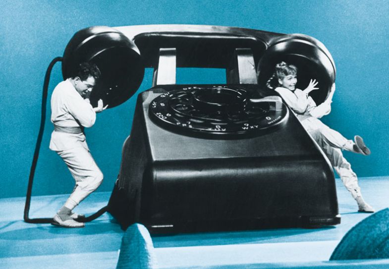 Debbie Reynolds and famous Mexican comedian Cantinflas in Columbia's Pepe, 1960 holding a huge telephone Debbie Reynolds and famous Mexican comedian Cantinflas in Columbia's Pepe, 1960 holding a huge telephone to illustrate pandemic cheers