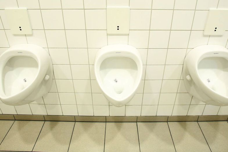 Flies painted on urinal as illustrated in the copy