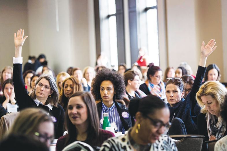 People raise their hands to ask questions. People raise their hands to ask questions.