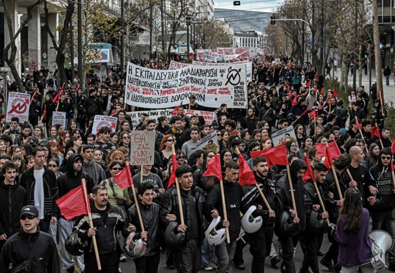 Protesters march during a students' demonstration in central Athens Protesters march during a students' demonstration in central Athens