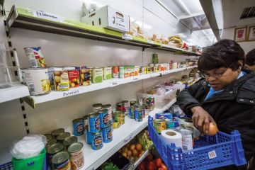A person working in a food bank A person working in a food bank