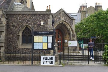 A 2017 polling station in Hove with a voter leaving after voting. A 2017 polling station in Hove with a voter leaving after voting.